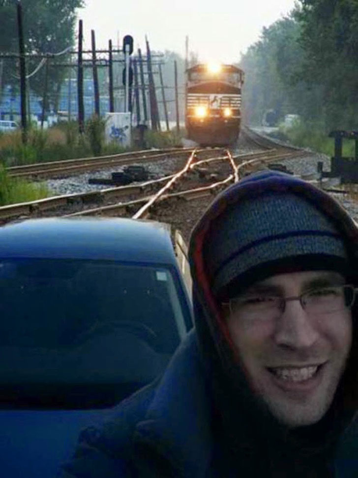 It's a real train, and the guy is stupid because it's really dangerous.