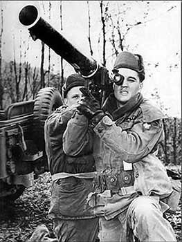 Elvis Presley Steadies a Bazooka in Germany (1958)