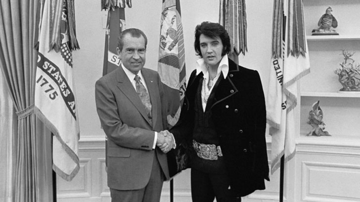 Nixon and Elvis holding hands - rumor has it that Elvis wrote Nixon a letter and this meeting came about