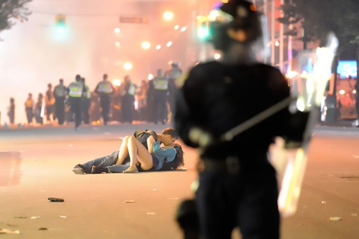 Kiss in the middle of an actual riot in Canada – 2011, the two are still together today and living in Melbourne, Australia